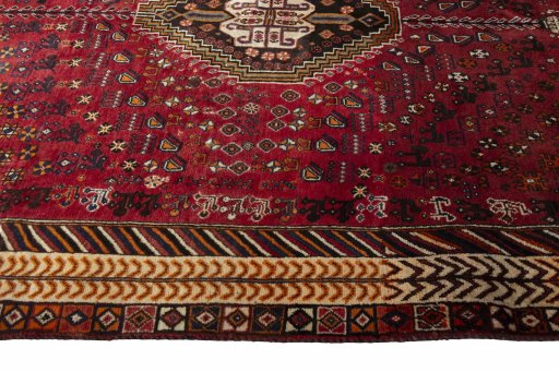 Full view of 2000s Shiraz rug from Iran / Persia, 276 × 165 cm in Red tones