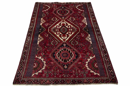 Surface texture of 2000s Shiraz rug with natural Wool and intricate pattern