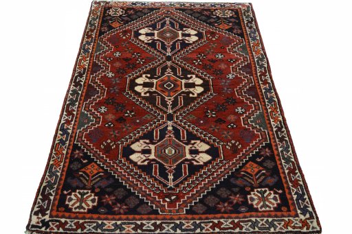 Surface texture of 2000s Shiraz rug with natural Wool and intricate pattern