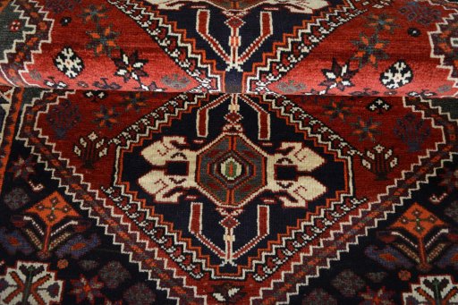 Full view of 2000s Shiraz rug from Iran / Persia, 159 × 110 cm in Red tones
