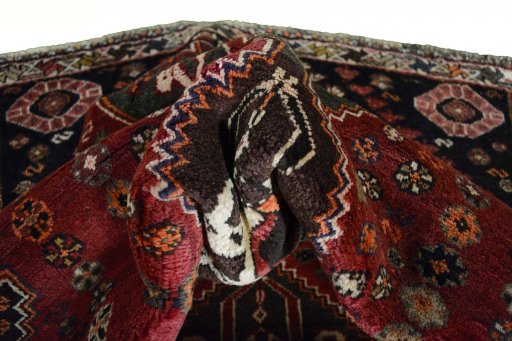 Corner detail of 2000s Shiraz rug showing border pattern and Wool pile