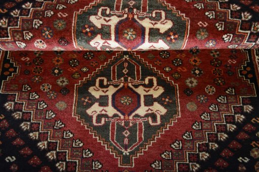 Full view of 2000s Shiraz rug from Iran / Persia, 160 × 110 cm in Red tones