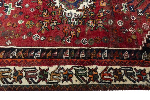 Corner detail of 2000s Shiraz rug showing border pattern and Wool pile
