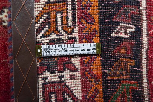 Backside of handmade 2000s Shiraz rug showing knot structure and weave density