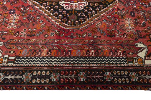 Corner detail of 2000s Shiraz rug showing border pattern and Wool pile
