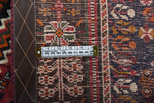 Backside of handmade 2000s Shiraz rug showing knot structure and weave density