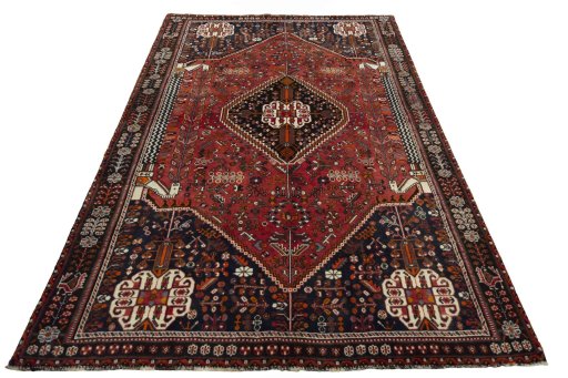 Surface texture of 2000s Shiraz rug with natural Wool and intricate pattern