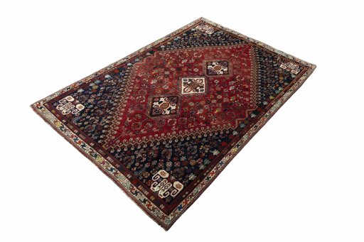 Corner detail of 2000s Shiraz rug showing border pattern and Wool pile