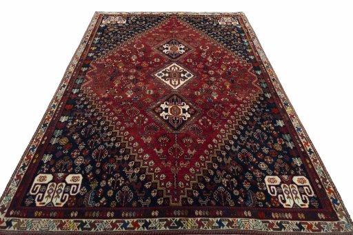 Surface texture of 2000s Shiraz rug with natural Wool and intricate pattern