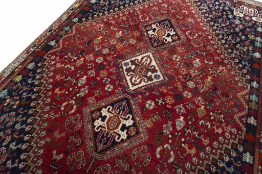 Backside of handmade 2000s Shiraz rug showing knot structure and weave density