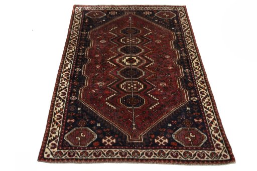 Surface texture of 2000s Shiraz rug with natural Wool and intricate pattern