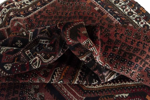Corner detail of 2000s Shiraz rug showing border pattern and Wool pile
