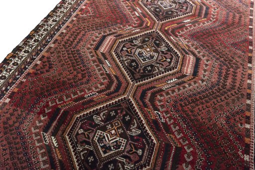 Backside of handmade 2000s Shiraz rug showing knot structure and weave density