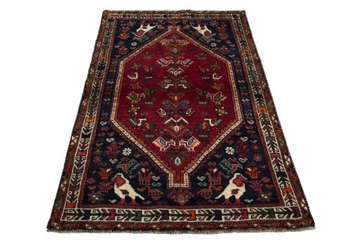 Surface texture of 2000s Shiraz rug with natural Wool and intricate pattern