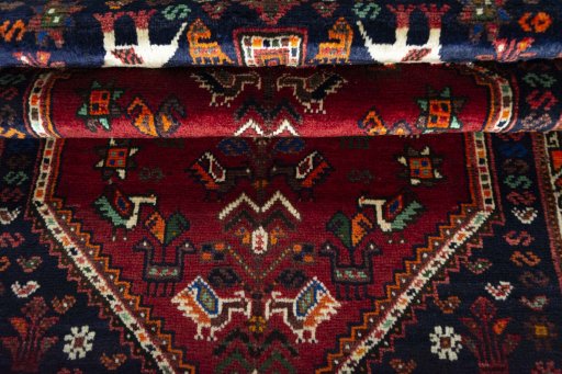 Full view of 2000s Shiraz rug from Iran / Persia, 167 × 107 cm in Red tones
