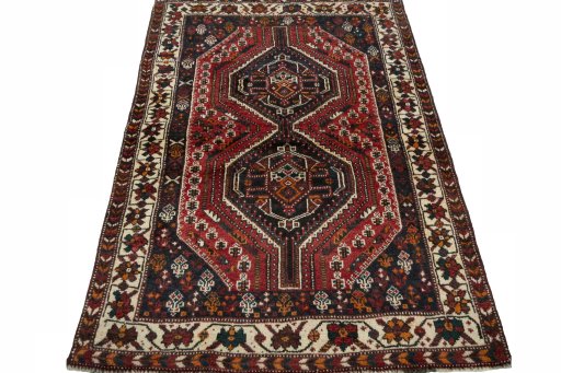 Surface texture of 2000s Shiraz rug with natural Wool and intricate pattern