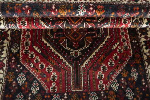 Full view of 2000s Shiraz rug from Iran / Persia, 158 × 106 cm in Red tones