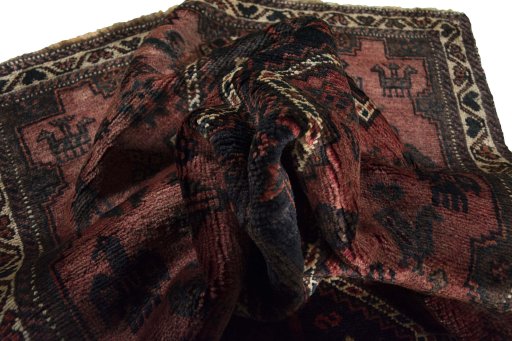 Corner detail of 2000s Shiraz rug showing border pattern and Wool pile