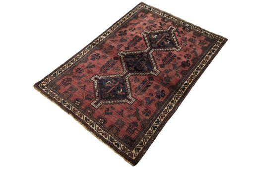 Corner detail of 2000s Shiraz rug showing border pattern and Wool pile