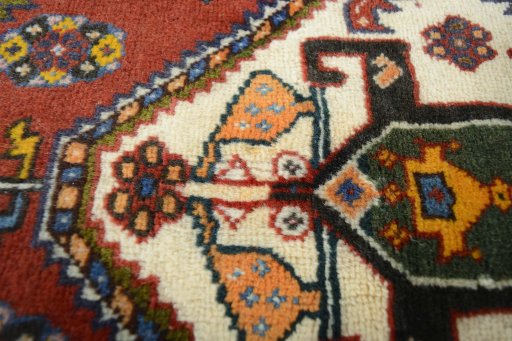 Surface texture of 2000s Shiraz rug with natural Wool and intricate pattern