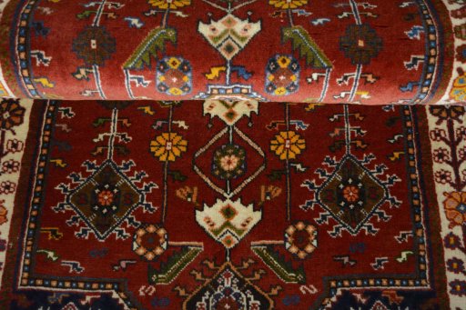 Backside of handmade 2000s Shiraz rug showing knot structure and weave density