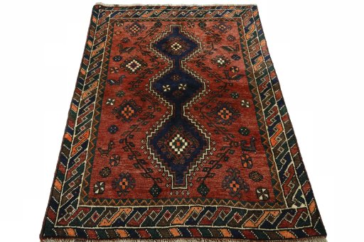 Surface texture of 2000s Shiraz rug with natural Wool and intricate pattern