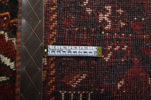 Corner detail of 2000s Shiraz rug showing border pattern and Wool pile