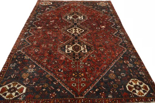 Surface texture of 2000s Shiraz rug with natural Wool and intricate pattern