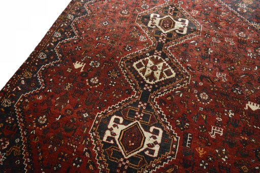 Backside of handmade 2000s Shiraz rug showing knot structure and weave density