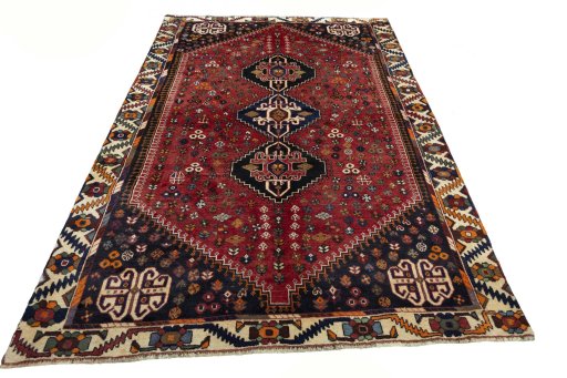 Surface texture of 2000s Shiraz rug with natural Wool and intricate pattern