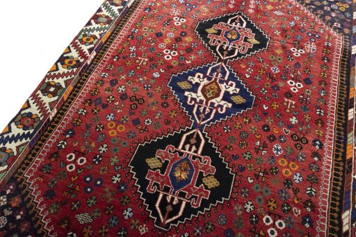 Backside of handmade 2000s Shiraz rug showing knot structure and weave density