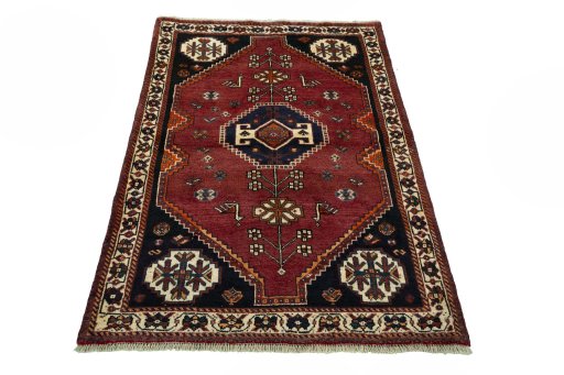 Surface texture of 2000s Shiraz rug with natural Wool and intricate pattern