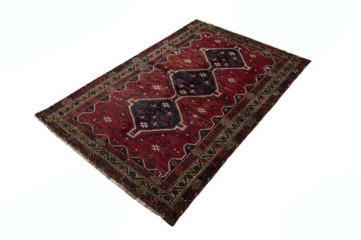 Corner detail of 2000s Shiraz rug showing border pattern and Wool pile