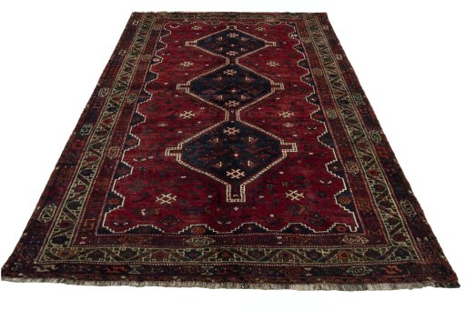 Surface texture of 2000s Shiraz rug with natural Wool and intricate pattern