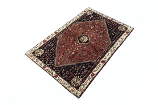 Corner detail of 2000s Shiraz rug showing border pattern and Wool pile