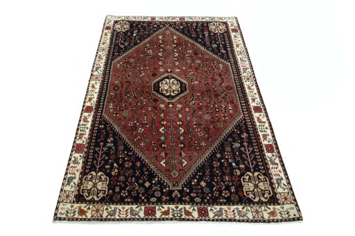Surface texture of 2000s Shiraz rug with natural Wool and intricate pattern