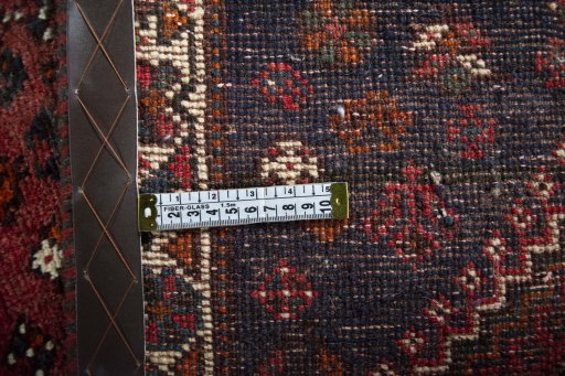Surface texture of 2000s Shiraz rug with natural Wool and intricate pattern