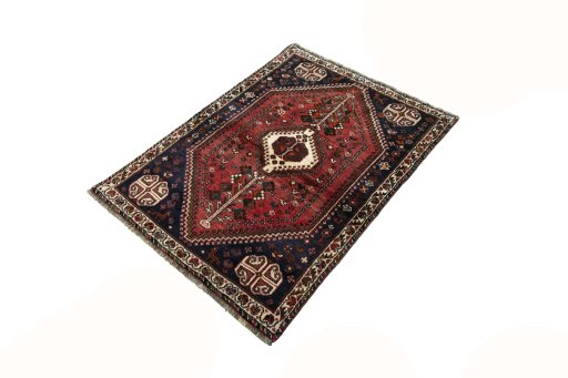 Corner detail of 2000s Shiraz rug showing border pattern and Wool pile
