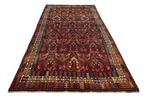 Surface texture of 2000s Shiraz rug with natural Wool and intricate pattern