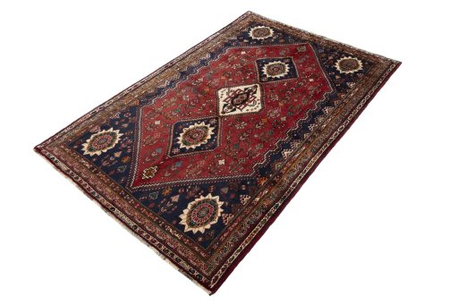 Corner detail of 2000s Shiraz rug showing border pattern and Wool pile
