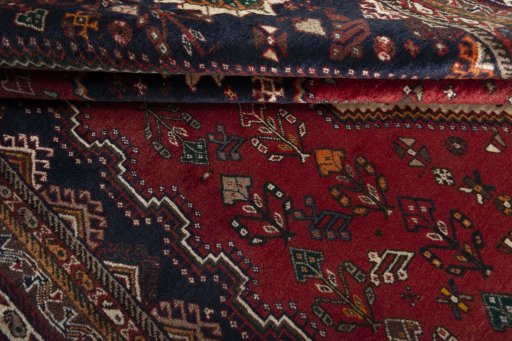Full view of 2000s Shiraz rug from Iran / Persia, 267 × 174 cm in Red tones