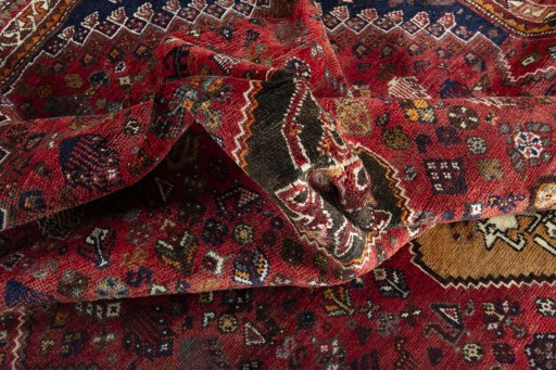 Surface texture of 2000s Shiraz rug with natural Wool and intricate pattern