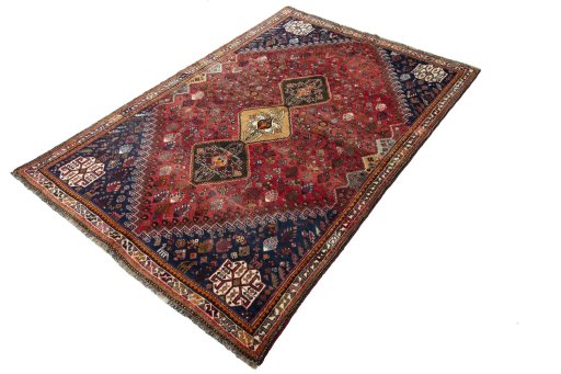 Corner detail of 2000s Shiraz rug showing border pattern and Wool pile