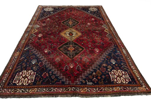 Surface texture of 2000s Shiraz rug with natural Wool and intricate pattern