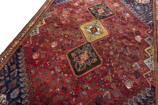 Backside of handmade 2000s Shiraz rug showing knot structure and weave density