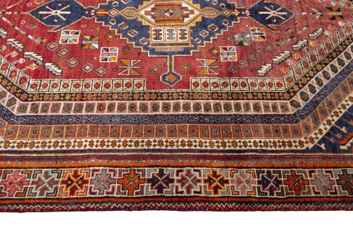 Corner detail of 2000s Shiraz rug showing border pattern and Wool pile