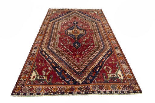 Surface texture of 2000s Shiraz rug with natural Wool and intricate pattern