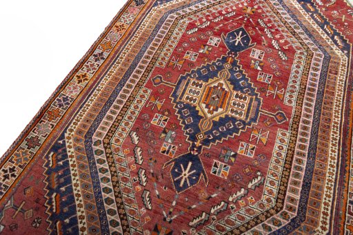 Backside of handmade 2000s Shiraz rug showing knot structure and weave density