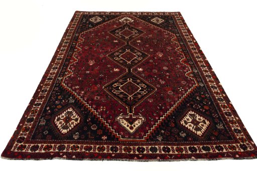 Surface texture of 2000s Shiraz rug with natural Wool and intricate pattern