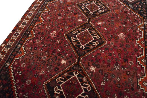 Backside of handmade 2000s Shiraz rug showing knot structure and weave density